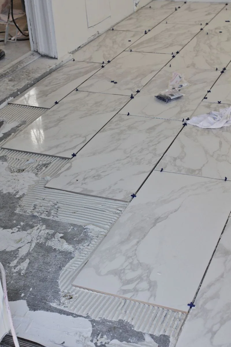 D:\Shosho\Darpedia Content\شهر سبتمبر\47\Guide-to-tile-a-bathroom-floor-with-marble-tiles.jpg
