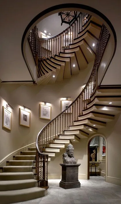 Beautiful.--- love the details... The artwork on the wall, how each individual stair is trimmed... Wow
